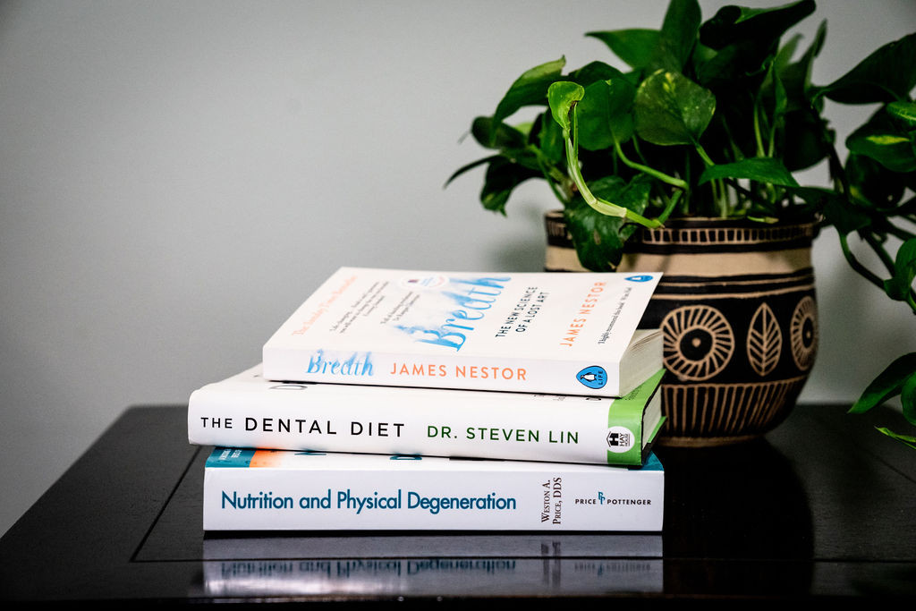 books sitting on table in dental office